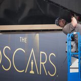 A man sets a digital display above the red carpet during preparations for the 86th Academy Awards in Hollywood, California February 26, 2014 A man sets a digital display above the red carpet during preparations for the 86th Academy Awards in Hollywood, California February 26, 2014