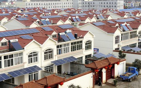 Solar panels are seen on the roofs of residential houses in Qingnan village of Lianyungang, Jiangsu province January 8, 2014. REUTERS/String Solar panels are seen on the roofs of residential houses in Qingnan village of Lianyungang, Jiangsu province January 8, 2014. REUTERS/String