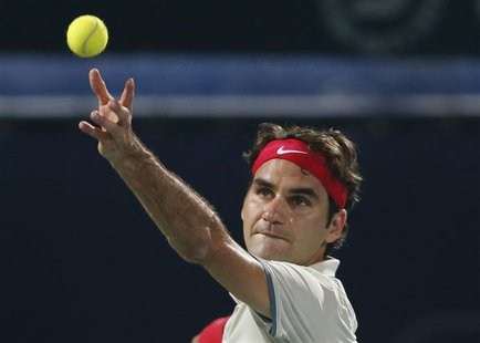 Roger Federer of Switzerland serves to Lukas Rosol of the Czech Republic during their men's singles match at the ATP Dubai Tennis Championsh Roger Federer of Switzerland serves to Lukas Rosol of the Czech Republic during their men's singles match at the ATP Dubai Tennis Championsh