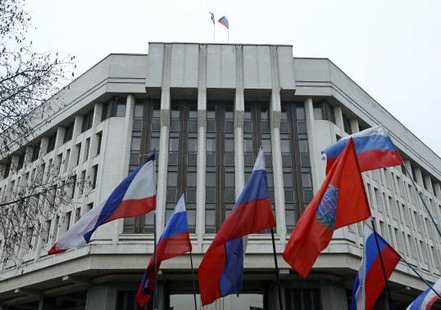 People hold flags during a pro-Russian rally outside the Crimean parliament building in Simferopol February 27, 2014. Armed men seized the regional government headquarters and parliament on Ukraine's Crimea peninsula on Thursday and raised the Russian flag in a challenge to the country's new rulers.
REUTERS/David Mdzinarishvili People hold flags during a pro-Russian rally outside the Crimean parliament building in Simferopol February 27, 2014. Armed men seized the regional government headquarters and parliament on Ukraine's Crimea peninsula on Thursday and raised the Russian flag in a challenge to the country's new rulers.
REUTERS/David Mdzinarishvili