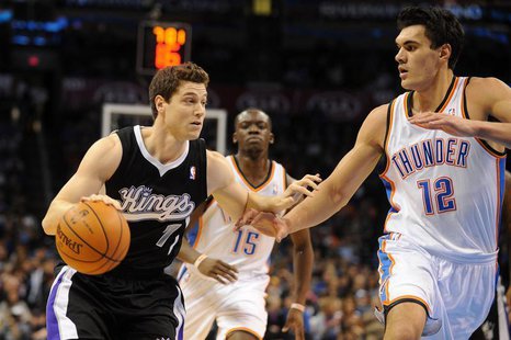 Jan 19, 2014; Oklahoma City, OK, USA; Sacramento Kings point guard Jimmer Fredette (7) dribbles the ball as Oklahoma City Thunder center Ste Jan 19, 2014; Oklahoma City, OK, USA; Sacramento Kings point guard Jimmer Fredette (7) dribbles the ball as Oklahoma City Thunder center Ste
