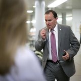 U.S. Senator Mike Lee (R-UT) talks on his mobile phone as he arrives for the weekly Republican caucus luncheon at the U.S. Capitol in Washin U.S. Senator Mike Lee (R-UT) talks on his mobile phone as he arrives for the weekly Republican caucus luncheon at the U.S. Capitol in Washin