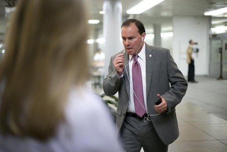 U.S. Senator Mike Lee (R-UT) talks on his mobile phone as he arrives for the weekly Republican caucus luncheon at the U.S. Capitol in Washin U.S. Senator Mike Lee (R-UT) talks on his mobile phone as he arrives for the weekly Republican caucus luncheon at the U.S. Capitol in Washin