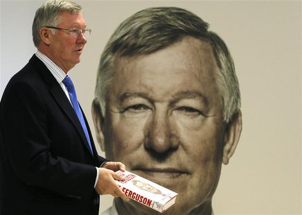 Former Manchester United manager Alex Ferguson poses with his new autobiography before a book signing at a supermarket in Manchester, northe Former Manchester United manager Alex Ferguson poses with his new autobiography before a book signing at a supermarket in Manchester, northe