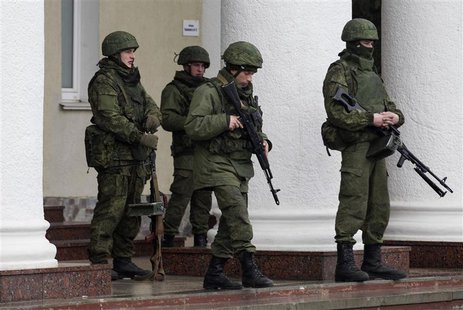 Armed men stand guard at the Simferopol airport in the Crimea region February 28, 2014. REUTERS/Baz Ratner Armed men stand guard at the Simferopol airport in the Crimea region February 28, 2014. REUTERS/Baz Ratner