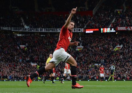 Manchester United's Robin Van Persie celebrates scoring against Stoke City during their English Premier League soccer match at Old Trafford Manchester United's Robin Van Persie celebrates scoring against Stoke City during their English Premier League soccer match at Old Trafford