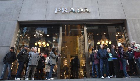 People stand outside a Prada store on 5th Ave during Black Friday Sales in New York November 29, 2013. REUTERS/Carlo Allegri People stand outside a Prada store on 5th Ave during Black Friday Sales in New York November 29, 2013. REUTERS/Carlo Allegri