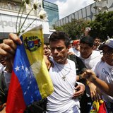 Venezuelan opposition leader Leopoldo Lopez is escorted by supporters before handing himself over in Caracas February 18, 2014. REUTERS/Jorg Venezuelan opposition leader Leopoldo Lopez is escorted by supporters before handing himself over in Caracas February 18, 2014. REUTERS/Jorg