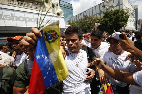 Venezuelan opposition leader Leopoldo Lopez is escorted by supporters before handing himself over in Caracas February 18, 2014. REUTERS/Jorg Venezuelan opposition leader Leopoldo Lopez is escorted by supporters before handing himself over in Caracas February 18, 2014. REUTERS/Jorg