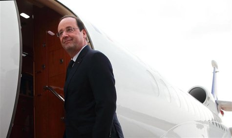 French President Francois Hollande boards his plane as he leaves Abuja, Nigeria's federal capital, February 28, 2014. REUTERS/Philippe Wojaz French President Francois Hollande boards his plane as he leaves Abuja, Nigeria's federal capital, February 28, 2014. REUTERS/Philippe Wojaz