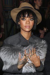 Singer Rihanna poses before the Lanvin Fall/Winter 2014-2015 women's ready-to-wear collection show during Paris Fashion Week February 27, 20 Singer Rihanna poses before the Lanvin Fall/Winter 2014-2015 women's ready-to-wear collection show during Paris Fashion Week February 27, 20