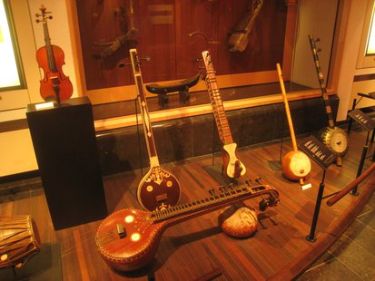 A collection of stringed instruments. A collection of stringed instruments.