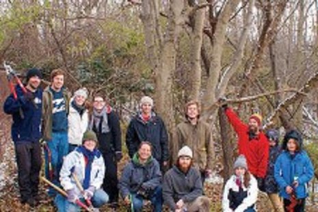 Stephan Keto with students, alumni and volunteers in front of the large dwarf hackberry tree. Stephan Keto with students, alumni and volunteers in front of the large dwarf hackberry tree.