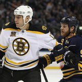 Feb 26, 2014; Buffalo, NY, USA; Boston Bruins left wing Milan Lucic (17) and Buffalo Sabres center Steve Ott (9) battle for position during Feb 26, 2014; Buffalo, NY, USA; Boston Bruins left wing Milan Lucic (17) and Buffalo Sabres center Steve Ott (9) battle for position during