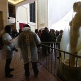 Tourists wearing rain gear stand next to Oscar statues covered with plastic during preparations for the 86th Academy Awards at the Dolby The Tourists wearing rain gear stand next to Oscar statues covered with plastic during preparations for the 86th Academy Awards at the Dolby The