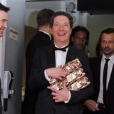 French actor Guillaume Gallienne (C) holds his trophy during a photocall after receiving the Best Actor, Best first Film, Best adaptated Scr French actor Guillaume Gallienne (C) holds his trophy during a photocall after receiving the Best Actor, Best first Film, Best adaptated Scr