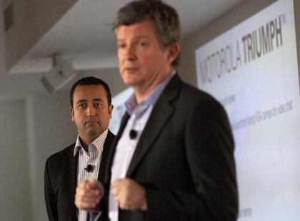 Product Chief at Sprint, Fared Adib (L) watches on as Motorola Senior Vice President of Product Development, Alain Mutricy speaks at the lau Product Chief at Sprint, Fared Adib (L) watches on as Motorola Senior Vice President of Product Development, Alain Mutricy speaks at the lau