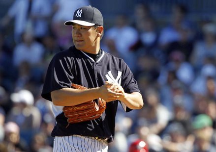 Mar 1, 2014; Tampa, FL, USA; New York Yankees pitcher Masahiro Tanaka (19) looks on during the sixth inning against the Philadelphia Phillie Mar 1, 2014; Tampa, FL, USA; New York Yankees pitcher Masahiro Tanaka (19) looks on during the sixth inning against the Philadelphia Phillie