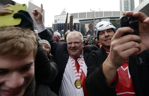Toronto Mayor Rob Ford (C) celebrates Team Canada's gold medal win over Sweden in the men's ice hockey gold medal game at the Sochi 2014 Win Toronto Mayor Rob Ford (C) celebrates Team Canada's gold medal win over Sweden in the men's ice hockey gold medal game at the Sochi 2014 Win
