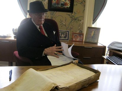 Dudley Martin looks at handwritten manuscripts written by Robert Stroud at his home in Springfield, Missouri, February 12, 2014. REUTERS/Kev Dudley Martin looks at handwritten manuscripts written by Robert Stroud at his home in Springfield, Missouri, February 12, 2014. REUTERS/Kev