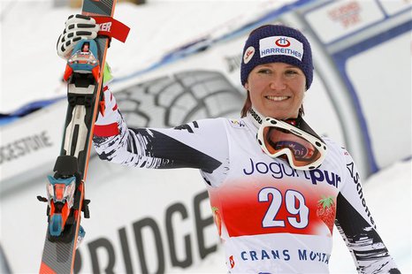 Andrea Fischbacher of Austria celebrates winning the women's FIS Alpine Skiing World Cup Downhill race on her way to the podium in the Swiss Andrea Fischbacher of Austria celebrates winning the women's FIS Alpine Skiing World Cup Downhill race on her way to the podium in the Swiss