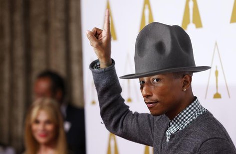 Rapper Pharrell Williams arrives at the 86th Academy Awards nominees luncheon in Beverly Hills, California February 10, 2014. REUTERS/Mario Rapper Pharrell Williams arrives at the 86th Academy Awards nominees luncheon in Beverly Hills, California February 10, 2014. REUTERS/Mario