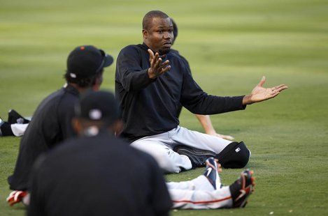 San Francisco Giants Guillermo Mota talks with teammates while he stretches during workouts ahead of Game 3 of Major League Baseball's World San Francisco Giants Guillermo Mota talks with teammates while he stretches during workouts ahead of Game 3 of Major League Baseball's World