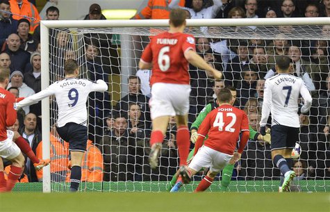 Tottenham Hotspur's Roberto Soldado (L) scores against Cardiff City during their English Premier League soccer match at White Hart Lane in L Tottenham Hotspur's Roberto Soldado (L) scores against Cardiff City during their English Premier League soccer match at White Hart Lane in L