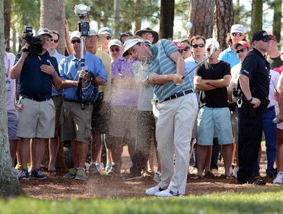 Mar 2, 2014; Palm Beach Gardens, FL, USA; Russell Henley from the pine straw on the eighth hole during the final round of The Honda Classic Mar 2, 2014; Palm Beach Gardens, FL, USA; Russell Henley from the pine straw on the eighth hole during the final round of The Honda Classic