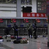 Police stand near luggages left at the ticket office after a group of armed men attacked people at Kunming railway station, Yunnan province, March 2, 2014. Credit: REUTERS/Stringer Police stand near luggages left at the ticket office after a group of armed men attacked people at Kunming railway station, Yunnan province, March 2, 2014. Credit: REUTERS/Stringer