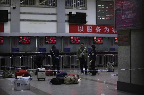Police stand near luggages left at the ticket office after a group of armed men attacked people at Kunming railway station, Yunnan province, March 2, 2014. Credit: REUTERS/Stringer Police stand near luggages left at the ticket office after a group of armed men attacked people at Kunming railway station, Yunnan province, March 2, 2014. Credit: REUTERS/Stringer