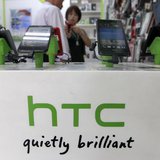 Customers look at HTC smartphones in a mobile phone shop in Taipei July 30, 2013. REUTERS/Pichi Chuang Customers look at HTC smartphones in a mobile phone shop in Taipei July 30, 2013. REUTERS/Pichi Chuang