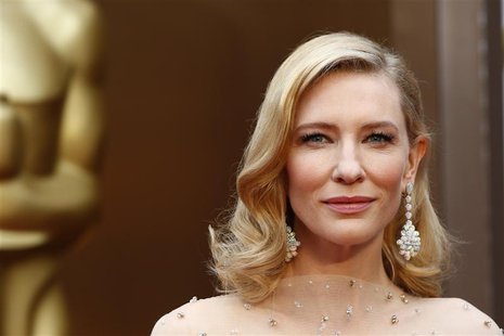 Cate Blanchett, best actress nominee for her role in "Blue Jasmine" wears a nude Armani gown with metallic embellishments as she poses at th Cate Blanchett, best actress nominee for her role in "Blue Jasmine" wears a nude Armani gown with metallic embellishments as she poses at th