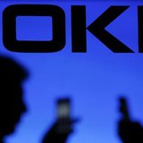 A photo illustration of men silhouetted against a Nokia logo in the central Bosnian town of Zenica January 23, 2014. REUTERS/Dado Ruvic A photo illustration of men silhouetted against a Nokia logo in the central Bosnian town of Zenica January 23, 2014. REUTERS/Dado Ruvic
