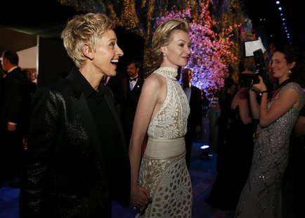 Academy Awards host Ellen Degeneres and her partner Portia de Rossi at the Governors Ball after the 86th Academy Awards in Hollywood, Califo Academy Awards host Ellen Degeneres and her partner Portia de Rossi at the Governors Ball after the 86th Academy Awards in Hollywood, Califo