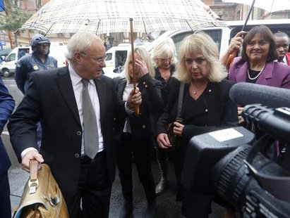 June Steenkamp (2nd R), mother of the murdered Reeva Steenkamp, arrives at the trial of Olympic and Paralympic track star Oscar Pistorius at June Steenkamp (2nd R), mother of the murdered Reeva Steenkamp, arrives at the trial of Olympic and Paralympic track star Oscar Pistorius at