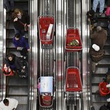 Shoppers ride an escalator at a Target Store in Chicago, November 25, 2011. REUTERS/John Gress Shoppers ride an escalator at a Target Store in Chicago, November 25, 2011. REUTERS/John Gress