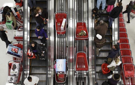 Shoppers ride an escalator at a Target Store in Chicago, November 25, 2011. REUTERS/John Gress Shoppers ride an escalator at a Target Store in Chicago, November 25, 2011. REUTERS/John Gress