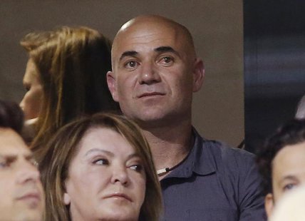 Former professional tennis player Andre Agassi attends the men's singles quarterfinal match between Rafael Nadal of Spain and Roger Federer Former professional tennis player Andre Agassi attends the men's singles quarterfinal match between Rafael Nadal of Spain and Roger Federer