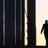 A worker arrives at his office in the Canary Wharf business district in London February 26, 2014. REUTERS/Eddie Keogh A worker arrives at his office in the Canary Wharf business district in London February 26, 2014. REUTERS/Eddie Keogh