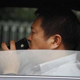 A man uses his iPhone as he drives a car along a main road in central Beijing September 24, 2012.
CREDIT: REUTERS/DAVID GRAY A man uses his iPhone as he drives a car along a main road in central Beijing September 24, 2012.
CREDIT: REUTERS/DAVID GRAY