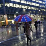 Workers walk in the rain at the Canary Wharf business district in London November 11, 2013. REUTERS/Eddie Keogh Workers walk in the rain at the Canary Wharf business district in London November 11, 2013. REUTERS/Eddie Keogh