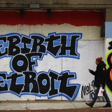A man walks past graffiti in Detroit, Michigan, December 3, 2013. REUTERS/Joshua Lott A man walks past graffiti in Detroit, Michigan, December 3, 2013. REUTERS/Joshua Lott