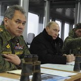 Russia's President Vladimir Putin (C), Defence Minister Sergei Shoigu (L) and head of the Russian army's main department of combat preparati Russia's President Vladimir Putin (C), Defence Minister Sergei Shoigu (L) and head of the Russian army's main department of combat preparati