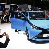A visitor takes pictures of Toyota Aygo during the media day ahead of the 84th Geneva Motor Show at the Palexpo Arena in Geneva March 4, 201 A visitor takes pictures of Toyota Aygo during the media day ahead of the 84th Geneva Motor Show at the Palexpo Arena in Geneva March 4, 201