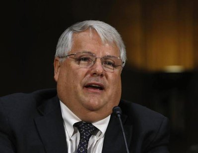 Apple's CFO Peter Oppenheimer appears before a Senate homeland security and governmental affairs investigations subcommittee hearing on offs Apple's CFO Peter Oppenheimer appears before a Senate homeland security and governmental affairs investigations subcommittee hearing on offs