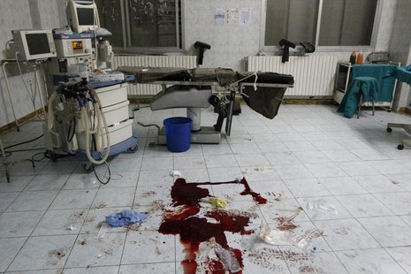 Blood is seen on a hospital floor in what activists say was shelling from forces loyal to President Bashar Al-Assad in Raqqa, eastern Syria Blood is seen on a hospital floor in what activists say was shelling from forces loyal to President Bashar Al-Assad in Raqqa, eastern Syria