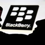 A man is silhouetted against a video screen with the Blackberry logo as he pose with a Blackberry Q10 in this photo illustration taken in th A man is silhouetted against a video screen with the Blackberry logo as he pose with a Blackberry Q10 in this photo illustration taken in th