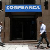 People walk in front of a CorpBanca branch office in downtown Santiago January 29, 2014. REUTERS/Ivan Alvarado People walk in front of a CorpBanca branch office in downtown Santiago January 29, 2014. REUTERS/Ivan Alvarado
