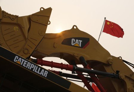 A Caterpillar excavator is displayed at the China Coal and Mining Expo 2013 in Beijing October 22, 2013. Picture taken October 22, 2013. REU A Caterpillar excavator is displayed at the China Coal and Mining Expo 2013 in Beijing October 22, 2013. Picture taken October 22, 2013. REU